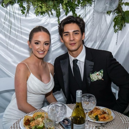 Chance Parez at their wedding reception with his wife Emma Smith.